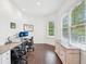Bright and spacious office featuring two desks, natural light, and a view of the outdoors at 1401 Kings Park Nw Dr, Kennesaw, GA 30152