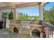 Outdoor kitchen featuring a built-in grill and stone accents at 1401 Kings Park Nw Dr, Kennesaw, GA 30152