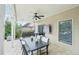 Covered patio with stone flooring, ceiling fan, and outdoor furniture set at 1401 Kings Park Nw Dr, Kennesaw, GA 30152