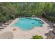 Community pool surrounded by lounge chairs at 1401 Kings Park Nw Dr, Kennesaw, GA 30152