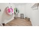 Spacious storage area with wood flooring, mini refrigerator, and shelving, perfect for organizing belongings at 1401 Kings Park Nw Dr, Kennesaw, GA 30152