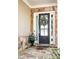 Elegant front entrance featuring a wreath on the door, stone accents, and decorative plants, creating a welcoming appeal at 4356 Jenkins Ne Dr, Roswell, GA 30075