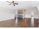 Expansive living room featuring hardwood floors and stylish bar with beverage fridge at 4356 Jenkins Ne Dr, Roswell, GA 30075