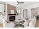 Bright living room showcasing a brick fireplace, built-in shelving, and access to the dining area, ideal for entertaining at 4356 Jenkins Ne Dr, Roswell, GA 30075