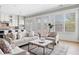 Open-concept living space showcasing a modern kitchen, comfortable seating, and an abundance of natural light at 4356 Jenkins Ne Dr, Roswell, GA 30075