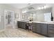 Elegant main bathroom with dual vanities, wood-look tile flooring, and walk-in closet at 4356 Jenkins Ne Dr, Roswell, GA 30075