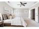 Spacious main bedroom featuring a ceiling fan, natural light, and an ensuite bath at 4356 Jenkins Ne Dr, Roswell, GA 30075