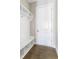 Well-organized mudroom with built-in bench, storage cubbies, hooks, and a conveniently located door at 4356 Jenkins Ne Dr, Roswell, GA 30075