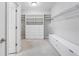 Well-organized walk-in closet with custom shelving, ample storage, and bright lighting at 4356 Jenkins Ne Dr, Roswell, GA 30075