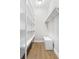 Spacious walk-in closet featuring custom shelving, drawers, and ample storage for clothing and accessories at 4356 Jenkins Ne Dr, Roswell, GA 30075