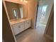 Bathroom with double vanity, modern fixtures, and granite countertops at 631 Skytop Dr, Cumming, GA 30040