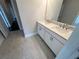 Bathroom with double vanity, modern fixtures, and granite countertops at 631 Skytop Dr, Cumming, GA 30040