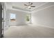 This Bedroom with carpet, recessed lighting, and tray ceilings features 2 windows at 631 Skytop Dr, Cumming, GA 30040