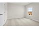 Bright bedroom with neutral carpeting and natural light coming in through one window at 631 Skytop Dr, Cumming, GA 30040