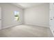 Bright bedroom with neutral carpeting and natural light coming in through one window at 631 Skytop Dr, Cumming, GA 30040