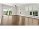 This bedroom features hardwood floors, recessed lighting, and a sliding door to the outside at 631 Skytop Dr, Cumming, GA 30040