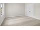 Bedroom with carpet flooring, one window and double doors leading to another room at 631 Skytop Dr, Cumming, GA 30040