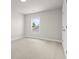 Bedroom with neutral carpet, white walls, a window and a closet with double doors at 631 Skytop Dr, Cumming, GA 30040