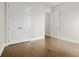 Bedroom with hardwood floors has large closet and white door at 631 Skytop Dr, Cumming, GA 30040