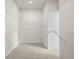 Walk-in closet with built-in shelving and neutral carpeting offering ample storage space at 631 Skytop Dr, Cumming, GA 30040