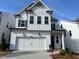 Charming two-story home with a two-car garage, white siding, and inviting curb appeal at 631 Skytop Dr, Cumming, GA 30040