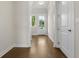 Bright foyer with hardwood floors, neutral paint, and views of the open-concept living space at 631 Skytop Dr, Cumming, GA 30040
