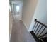 A hallway with carpet and a staircase at 631 Skytop Dr, Cumming, GA 30040