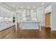 Modern kitchen featuring a large island, stainless appliances, and an open layout at 631 Skytop Dr, Cumming, GA 30040