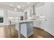 Modern kitchen featuring a large island, stainless appliances, and an open layout at 631 Skytop Dr, Cumming, GA 30040