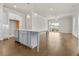 Modern kitchen featuring a large island, stainless appliances, and an open layout at 631 Skytop Dr, Cumming, GA 30040