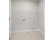Laundry room featuring tile flooring, utility connections, and a wire shelf for storage at 631 Skytop Dr, Cumming, GA 30040