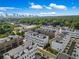 Community with an aerial view of modern townhomes in an urban setting and mature trees at 1048 Claudette Colvin Ct, Atlanta, GA 30318