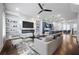 Open-concept living room featuring a marble fireplace, built-in shelving, and modern furnishings at 1048 Claudette Colvin Ct, Atlanta, GA 30318