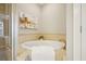 Elegant bathroom with a luxurious soaking tub and neutral toned tile surround at 1199 Huff Nw Rd # 127, Atlanta, GA 30318