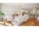 Open-concept living room with hardwood floors, modern lighting, and a view of the kitchen, perfect for entertaining at 1199 Huff Nw Rd # 127, Atlanta, GA 30318