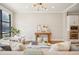 Bright living room with natural light, hardwood floors, console table, and a glimpse of the modern kitchen at 1199 Huff Nw Rd # 127, Atlanta, GA 30318