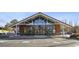 Charming restaurant exterior with large glass windows and ample outdoor seating, perfect for dining at 1199 Huff Nw Rd # 127, Atlanta, GA 30318