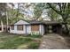 Compact, one level home with white brick and attached carport at 1809 San Gabriel Ave, Decatur, GA 30032