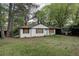 Cozy, single story house with white brick and attached carport at 1809 San Gabriel Ave, Decatur, GA 30032