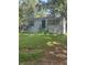 Traditional one-story home with painted brick, dark roof, green shutters, and an unkempt front yard at 2168 Clanton Ter, Decatur, GA 30034