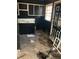 A kitchen with old cabinets, walls, and a single window at 2168 Clanton Ter, Decatur, GA 30034