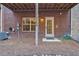 Townhome backyard with brick exterior, outdoor patio, well-maintained grounds, and outdoor storage at 2767 Durham Ne Dr, Atlanta, GA 30319