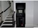 Stylish built-in bar area next to staircase featuring a 'Happy Hour' neon sign and wine cooler at 2767 Durham Ne Dr, Atlanta, GA 30319