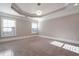 Spacious primary bedroom with tray ceilings, recessed lighting, and large windows, offering ample natural light at 2767 Durham Ne Dr, Atlanta, GA 30319