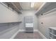 Walk-in closet with multiple storage shelves and hanging rods at 2767 Durham Ne Dr, Atlanta, GA 30319