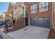 Exterior view of modern brick townhome featuring a private garage and steps to the main entrance at 2767 Durham Ne Dr, Atlanta, GA 30319