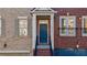 Close up of the front door and entrance of a brick townhome with garage at 2767 Durham Ne Dr, Atlanta, GA 30319