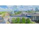 An aerial view capturing the building's architectural style with the city skyline and clear blue sky at 750 Park Ne Ave # 13E, Atlanta, GA 30326
