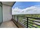 A balcony with a view of treetops and a serene neighborhood at 750 Park Ne Ave # 13E, Atlanta, GA 30326