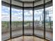 Stunning city skyline and treetop views from the balcony with a stone floor and black railings at 750 Park Ne Ave # 13E, Atlanta, GA 30326